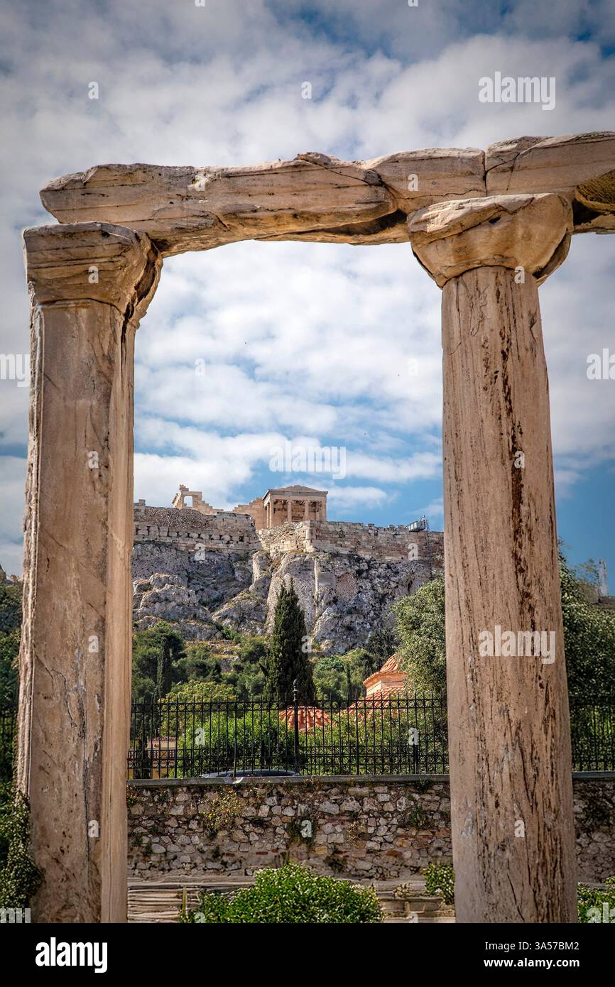 A few majestic columns still stand as a testament to the grandeur of Hadrian's Library in Athens, Greece. Stock Photo