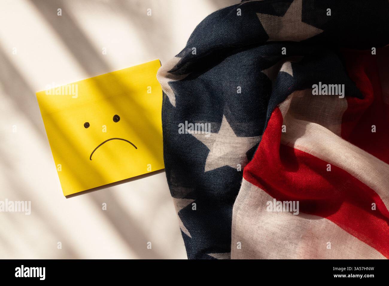 Drawn sad emotion on yellow paper