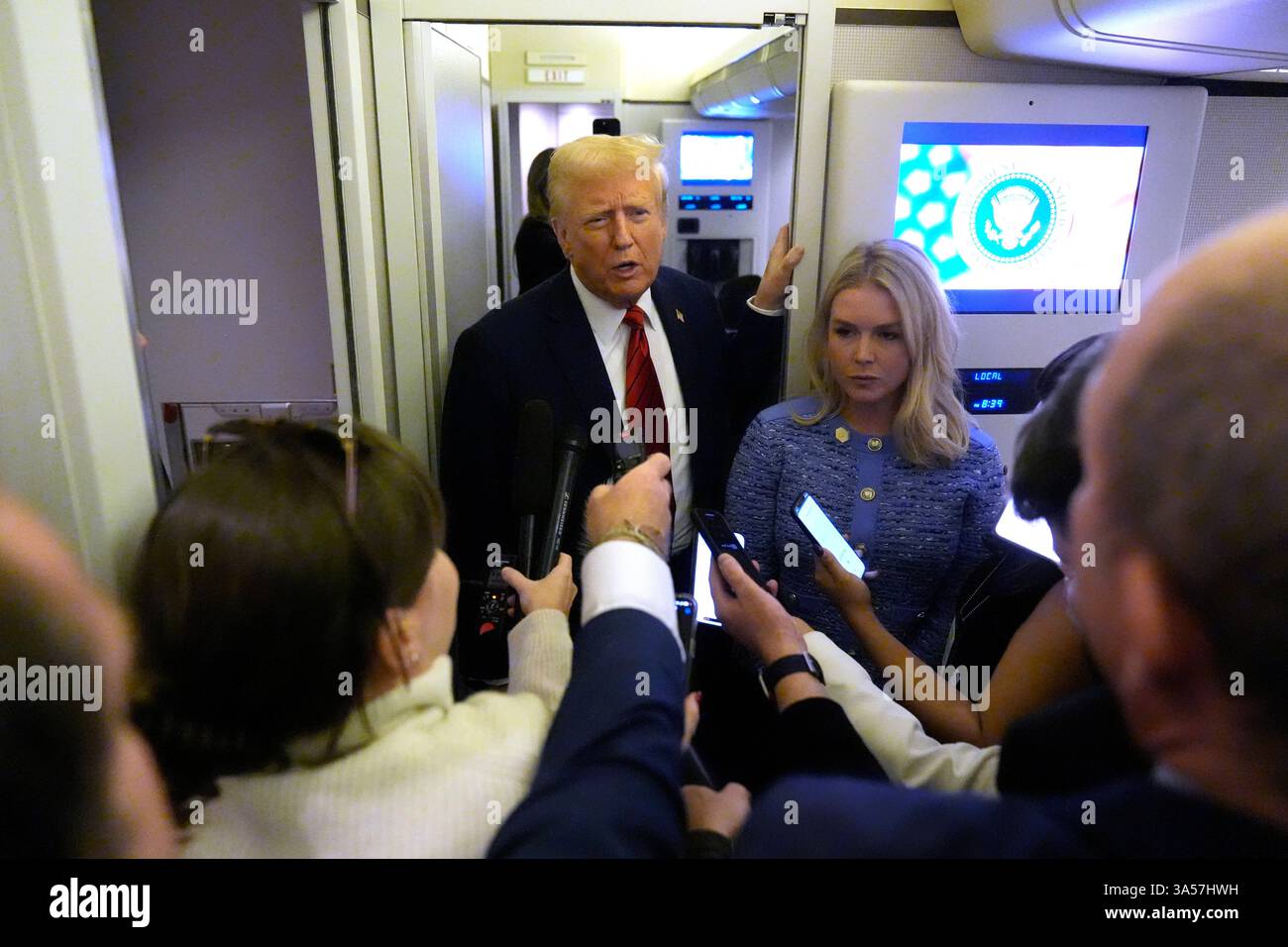 FILE - President Donald Trump speaks to reporters aboard Air Force One ...