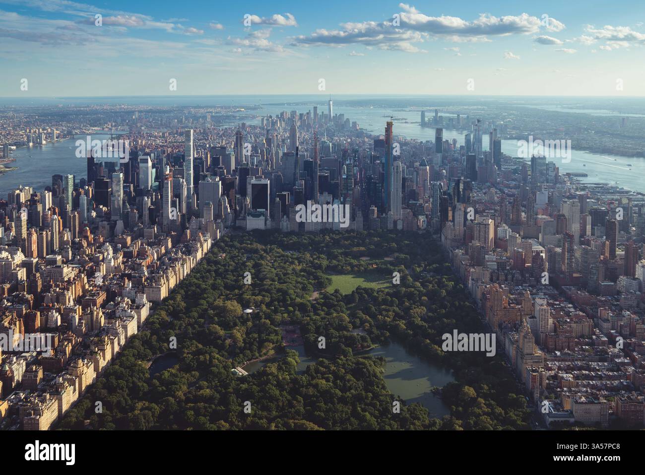 A breathtaking aerial view of New York City, showcasing Manhattan's skyscrapers and the vibrant greenery of Central Park. Stock Photo