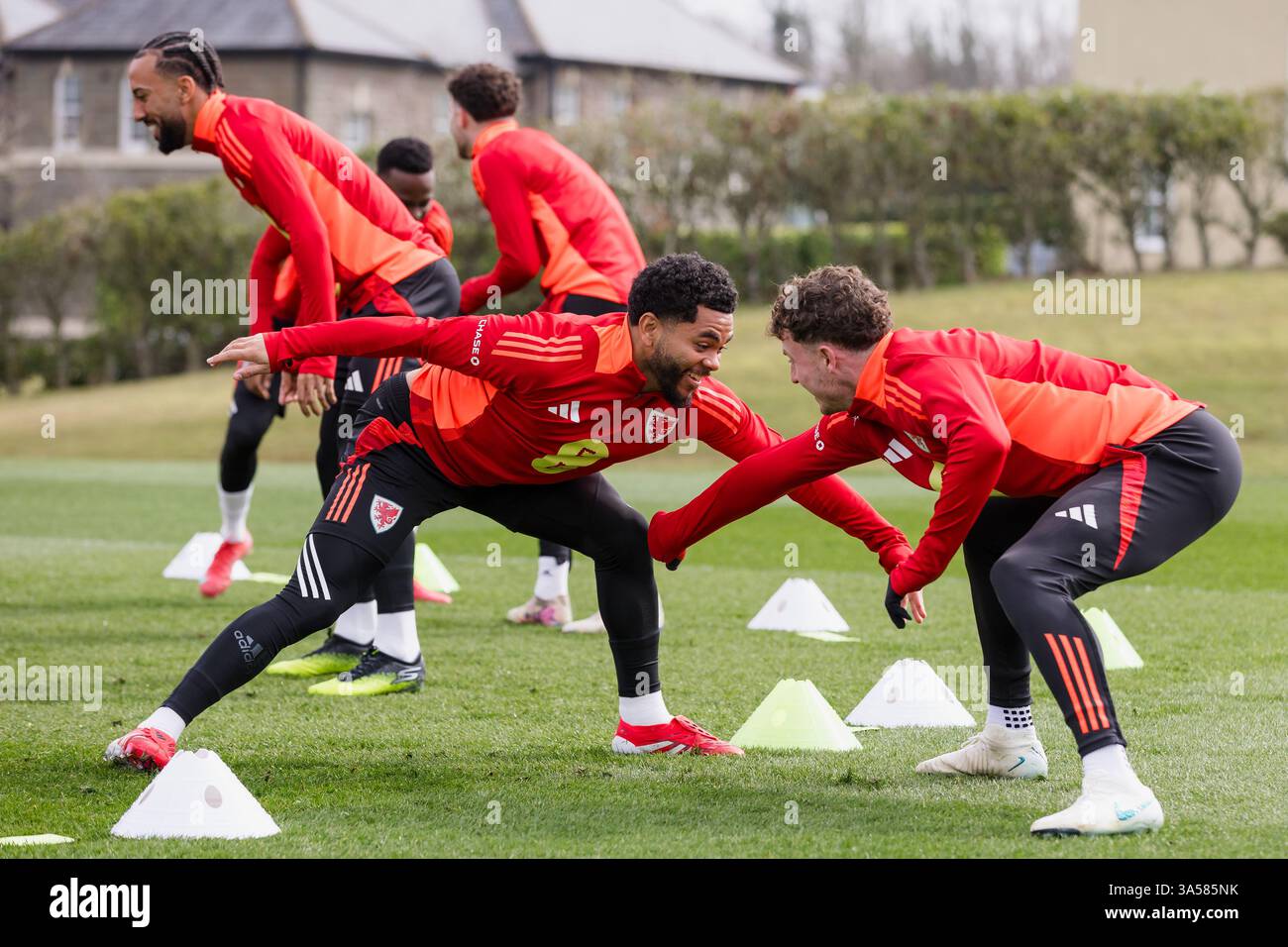 PONTYCLUN, WALES - 21 MARCH 2025: Wales' Jay Dasilva and Wales' Nathan ...