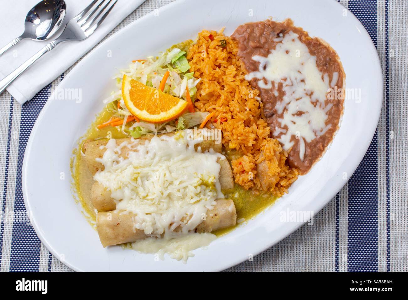 A top down view of a plate of enchiladas. Stock Photo