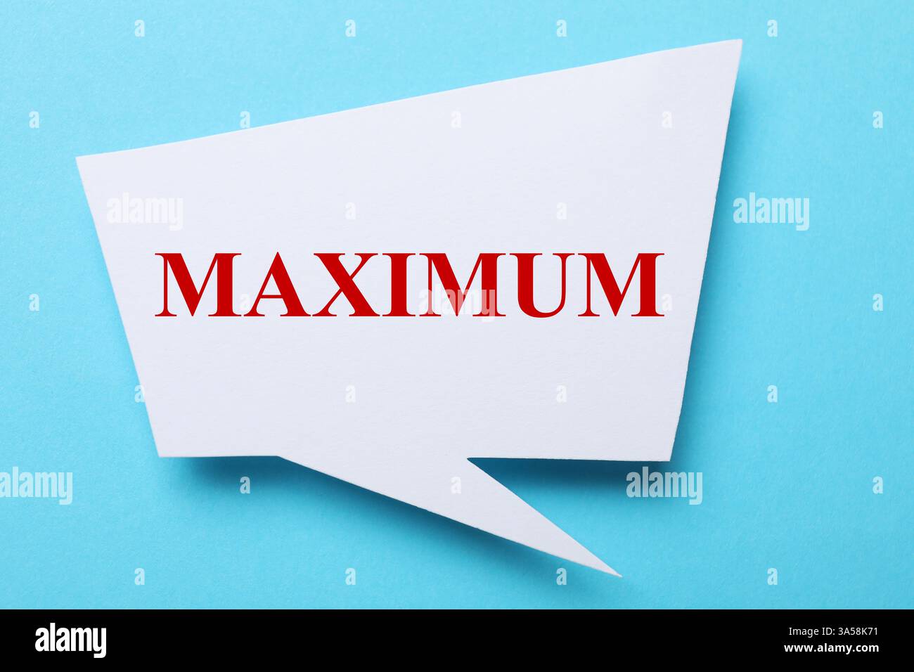 Speech bubble with word Maximum on light blue background, top view Stock Photo