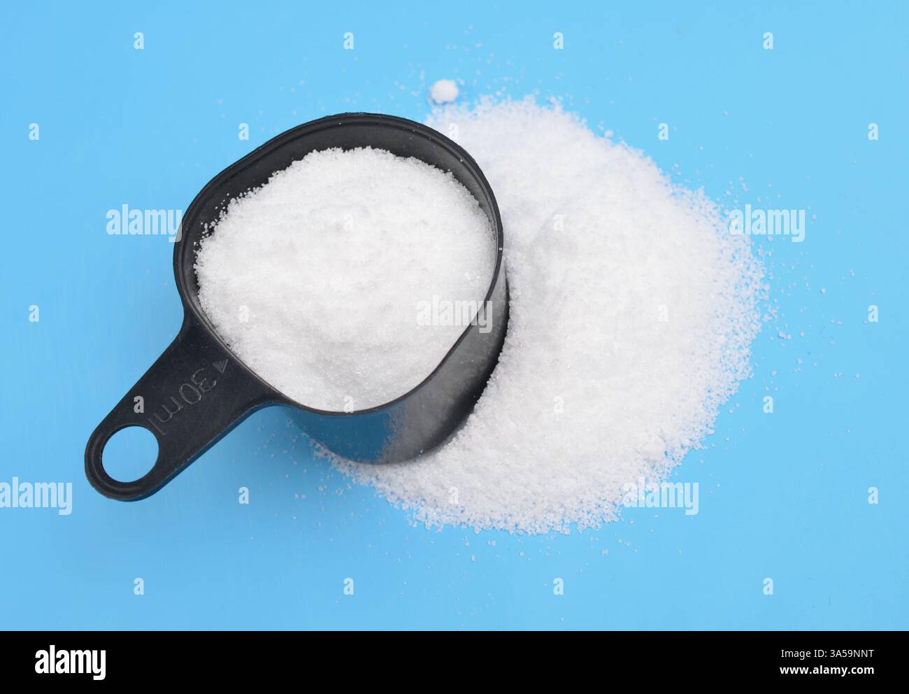 Thiourea powder on blue background Stock Photo