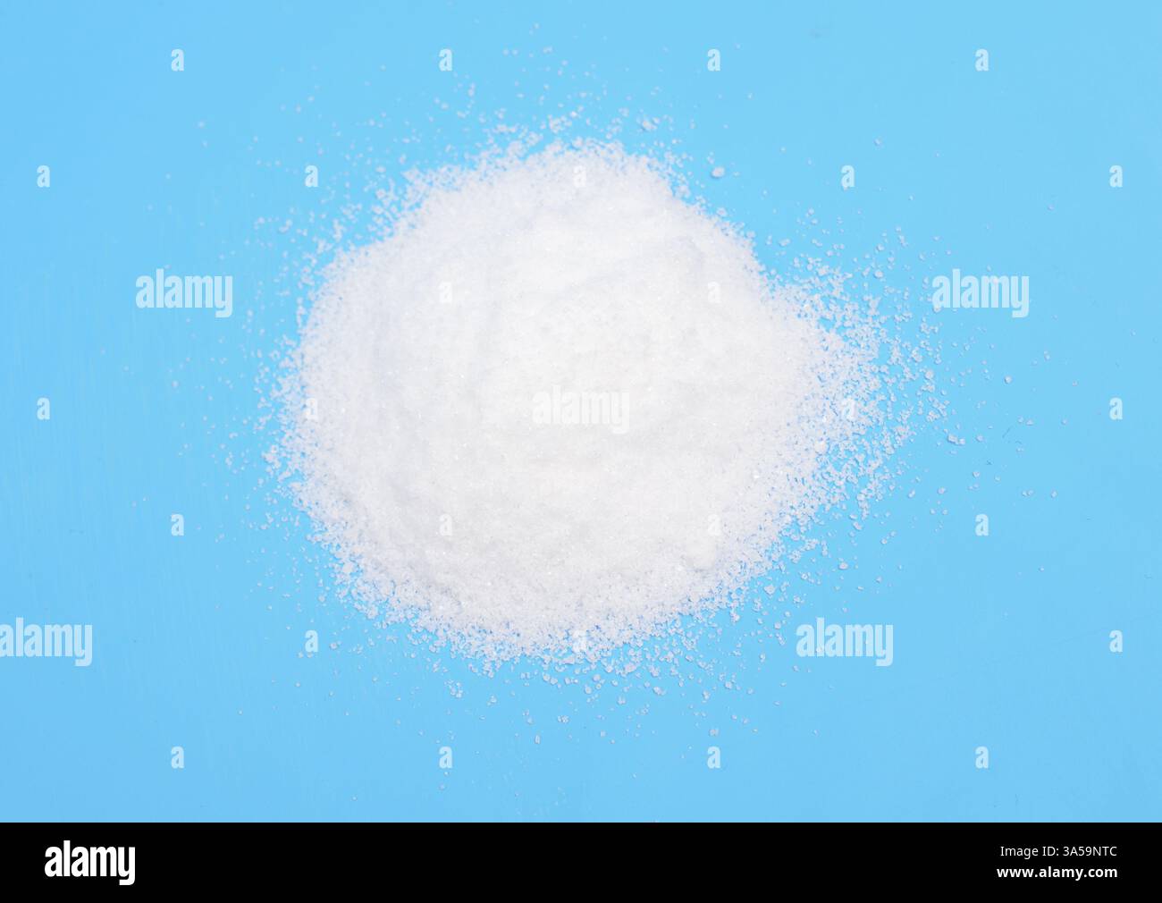 Thiourea powder on blue background Stock Photo