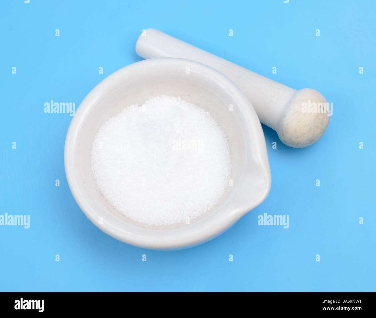 Thiourea powder on blue background Stock Photo