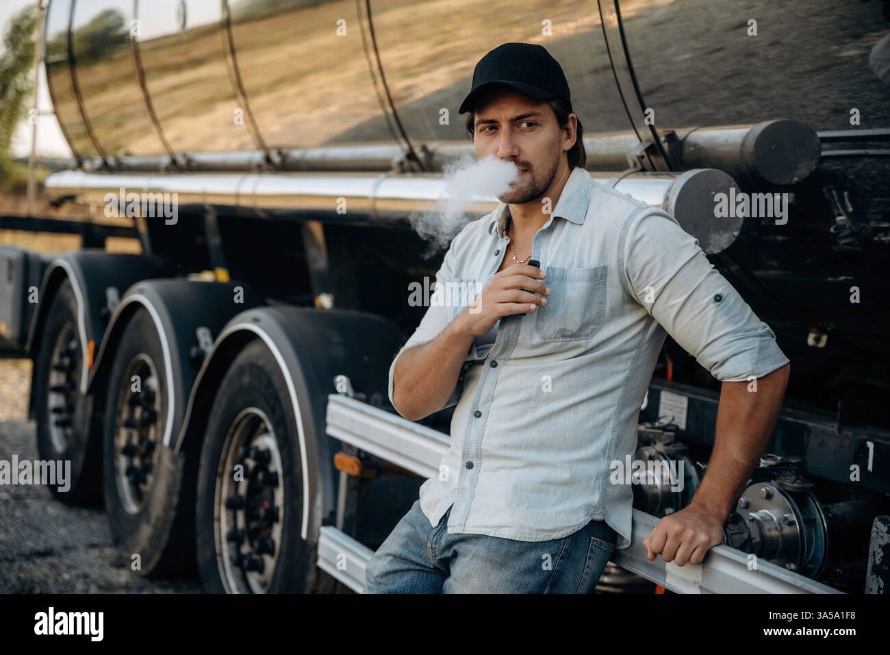 Driver smoking cigarette hi-res stock photography and images
