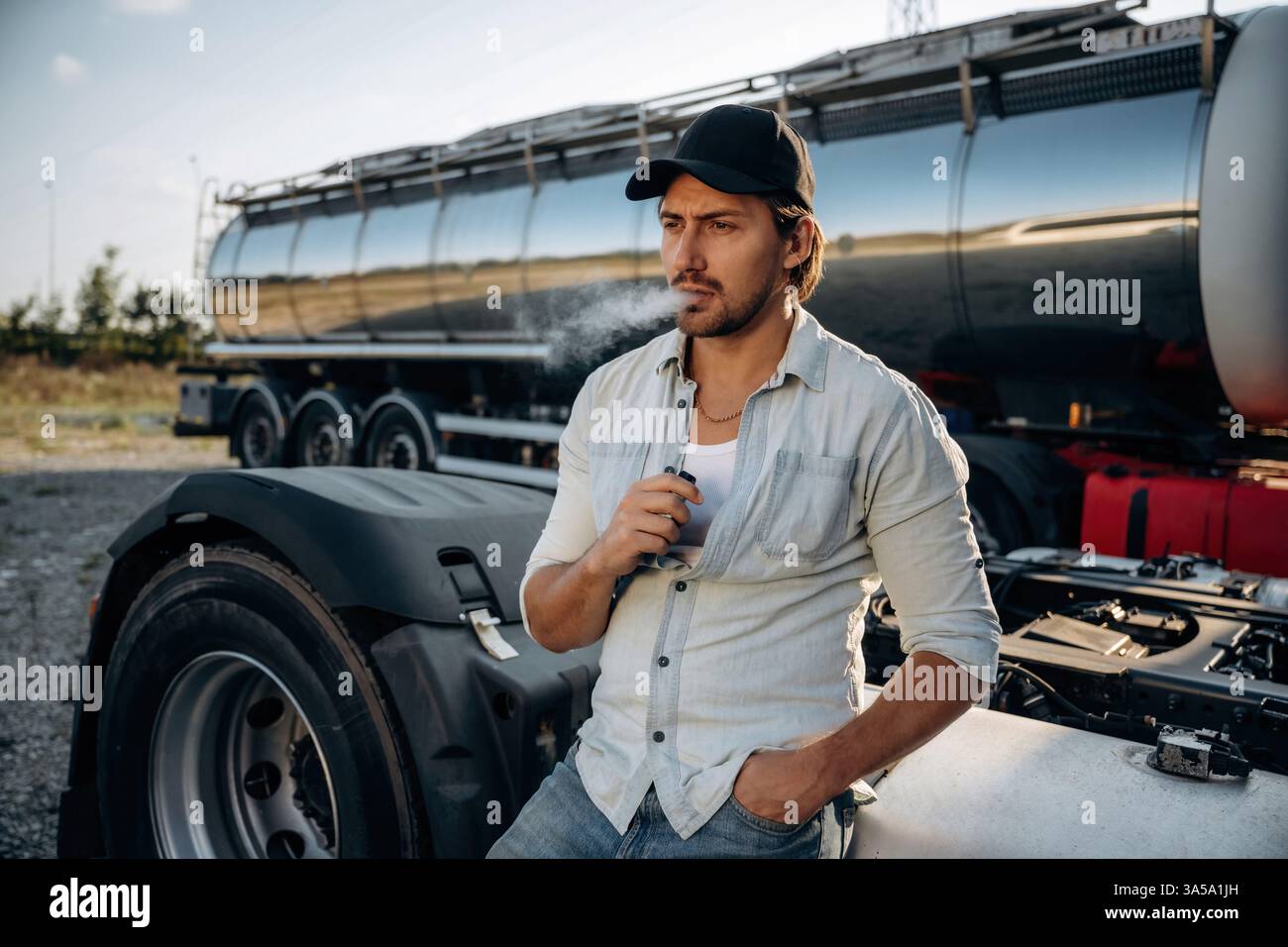 Driver smoking cigarette hi-res stock photography and images - Alamy Driver smoking cigarette hi-res stock photography and images - Alamy