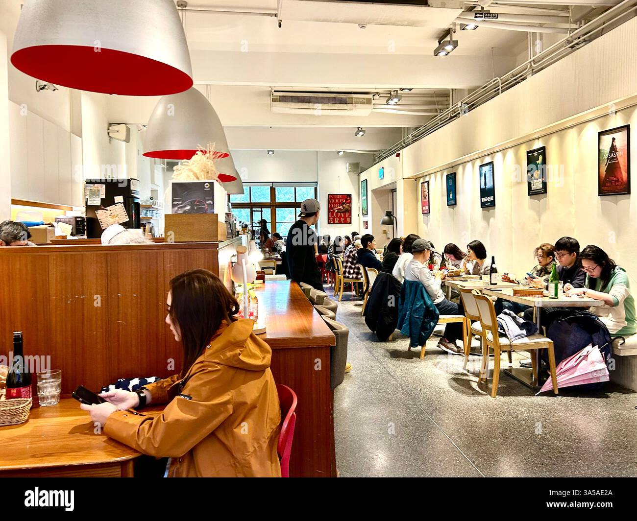 Taipei, Taiwan, Crowd People, Sitting at Tables, inside, Local Movie Theater, 'Huashan Art Cinemas',  Taiwanese Cinema Cafe, Central Art Park, - Smartphone Captured Stock Image