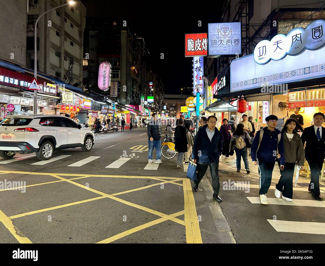 Taipei, Taiwan, Crowd People, Visiting, Shopping, Busy Street Scene, Night, teenagers out late, Crosswalk - Smartphone Captured Stock Image