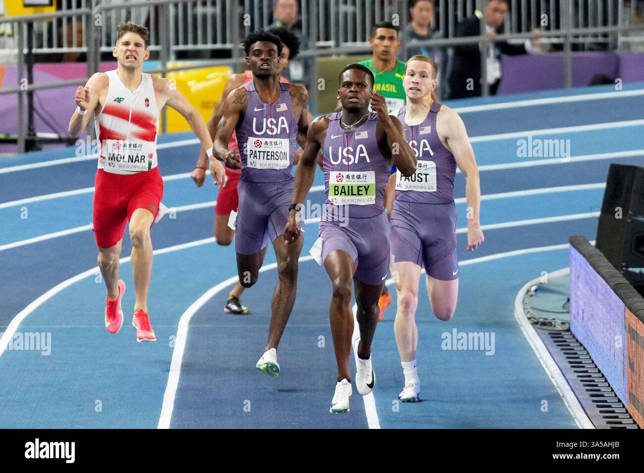 Christopher Bailey, of the United States, leads countrymen Jacory ...