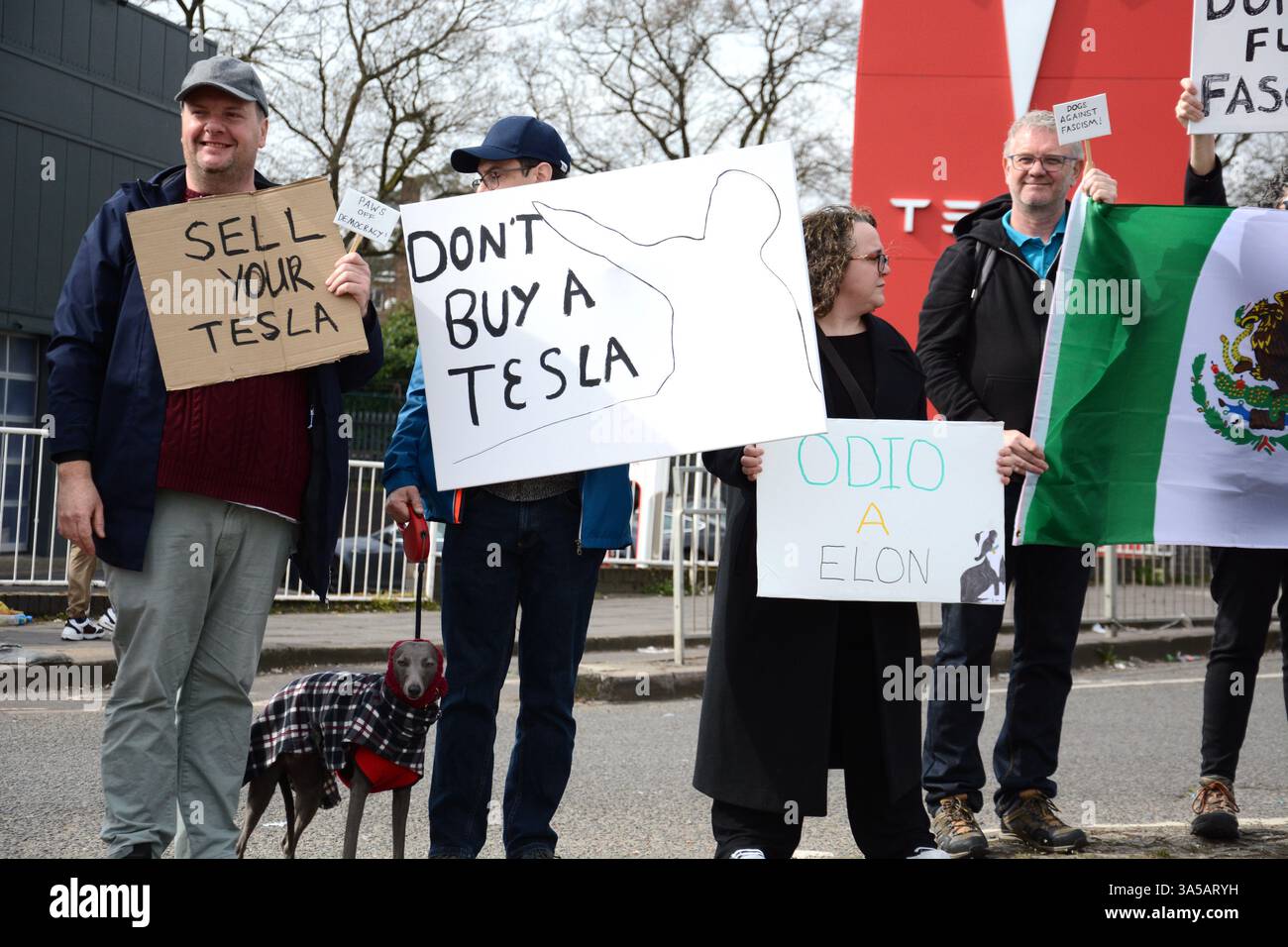 Anti Tesla demonstrators protest outside a Tesla centre showroom at ...