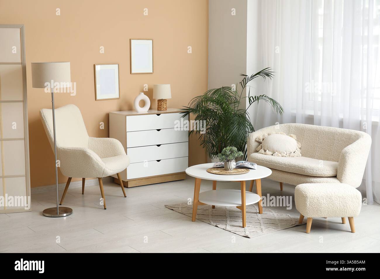 Interior of living room with cozy sofa, armchair and coffee table Stock ...