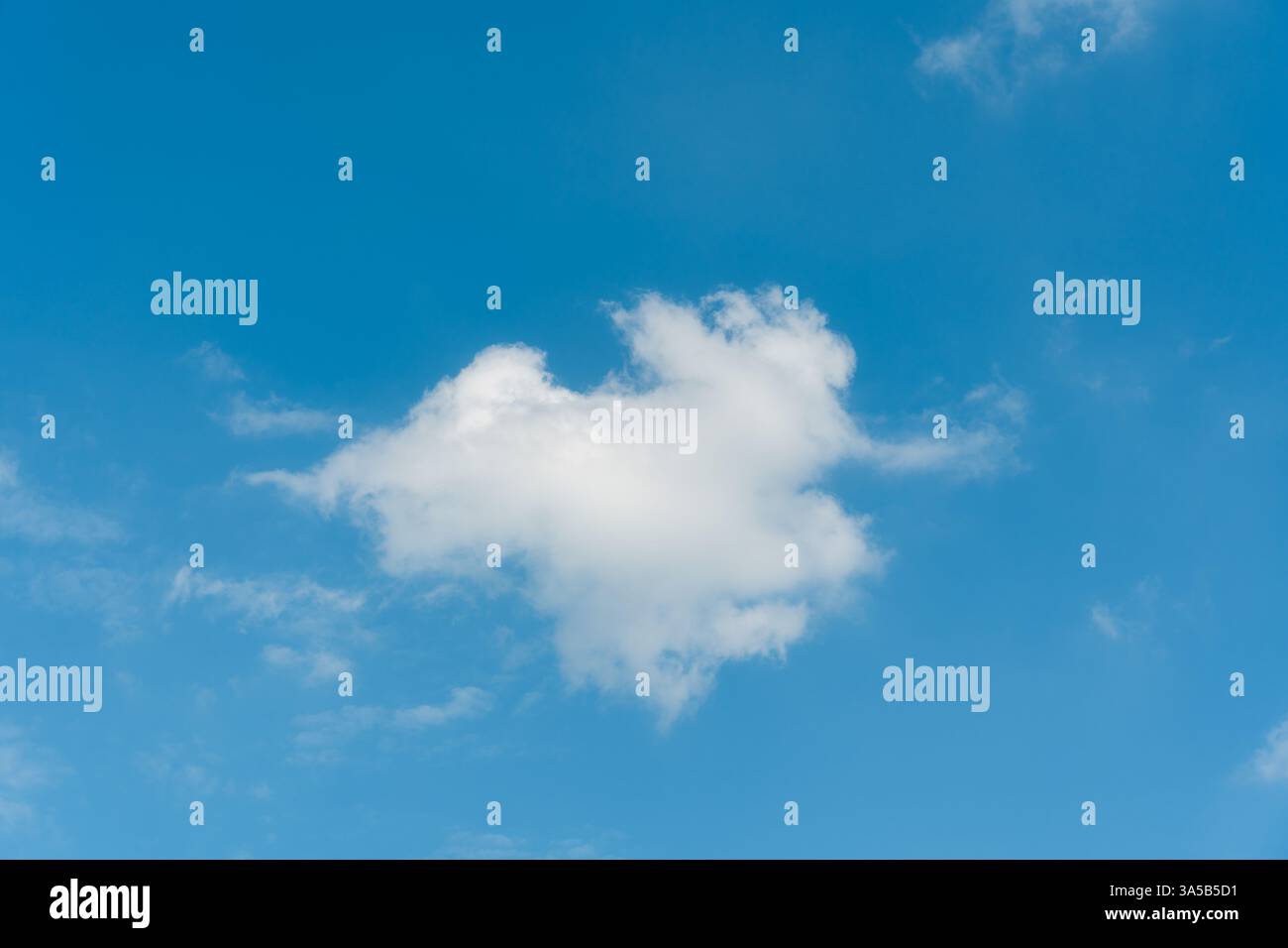 Fluffy white cloud float in bright blue sky on summer Stock Photo