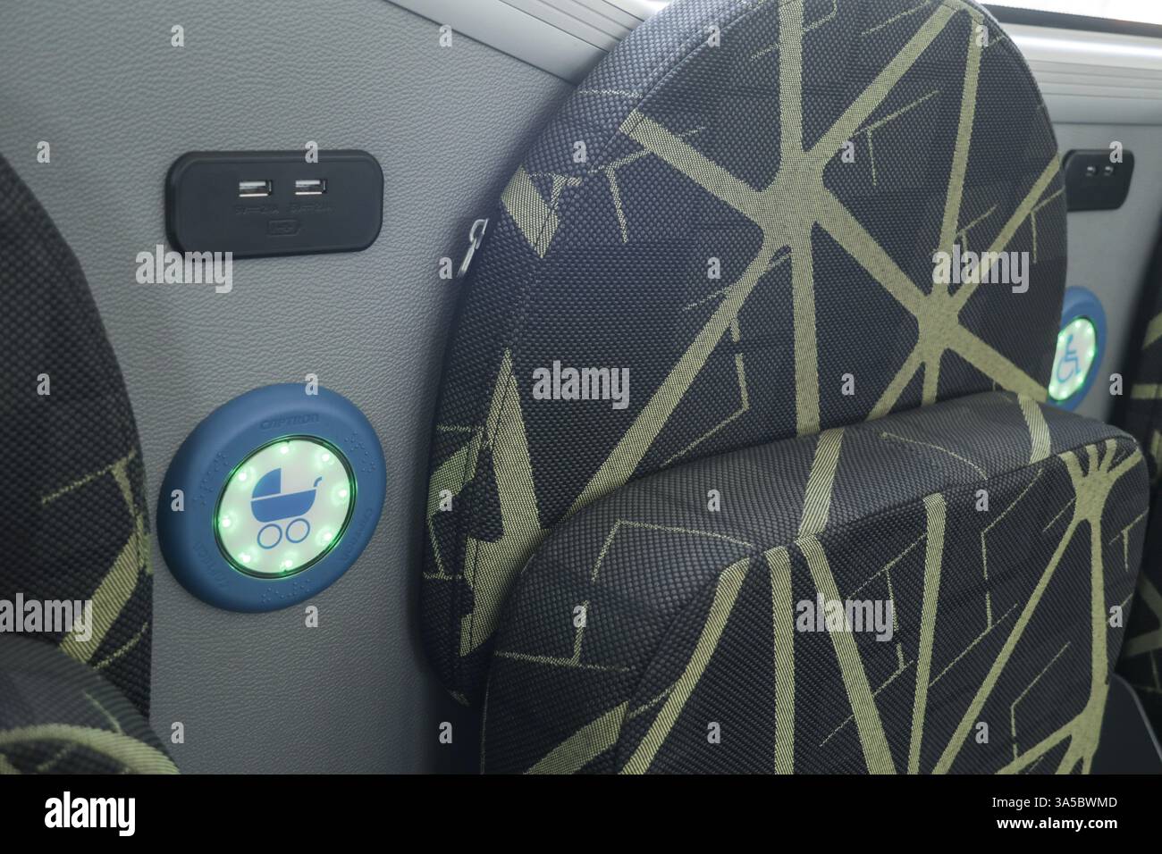 Reserved seat for wheelchairs inside a bus Stock Photo - Alamy