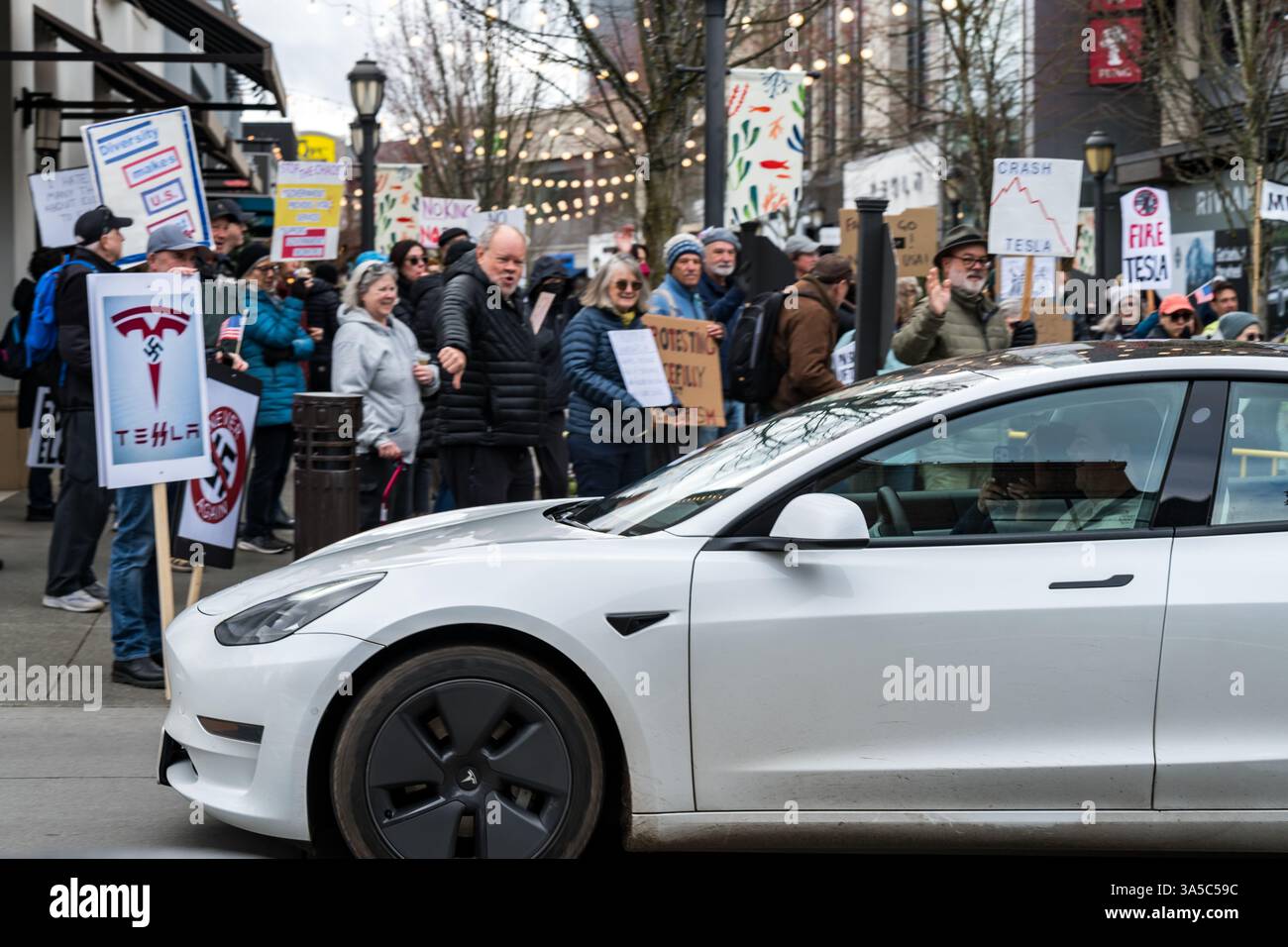 Tesla Outrage Seattle, USA. 22nd Mar 2025. Just after 10:00am Activists descend on ...