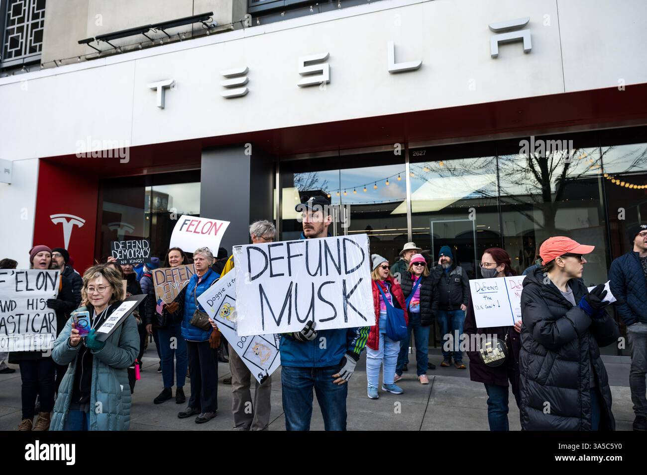 Tesla Outrage Seattle, USA. 22nd Mar 2025. Just after 10:00am Activists descend on ...
