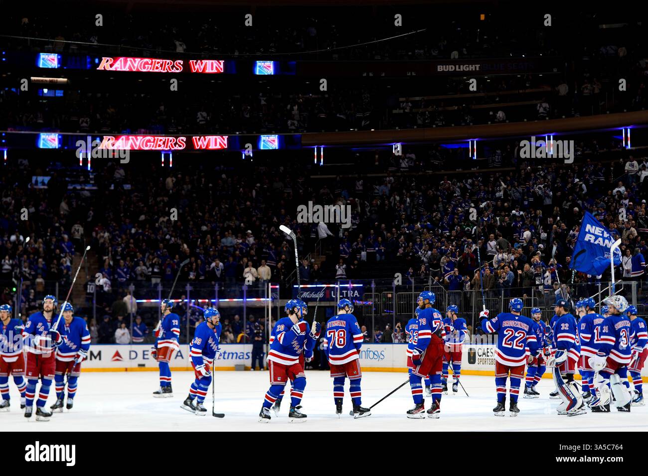 New York Rangers players celebrate following an NHL hockey game against ...