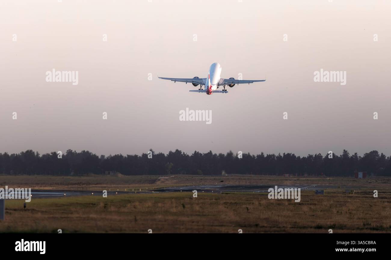 Large passenger airplane is taking off from the runway Stock Photo - Alamy