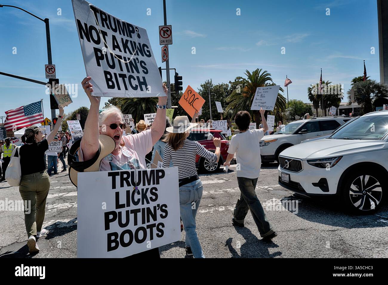 EDS NOTE: OBSCENITY - Protesters hold signs demonstrating against the ...