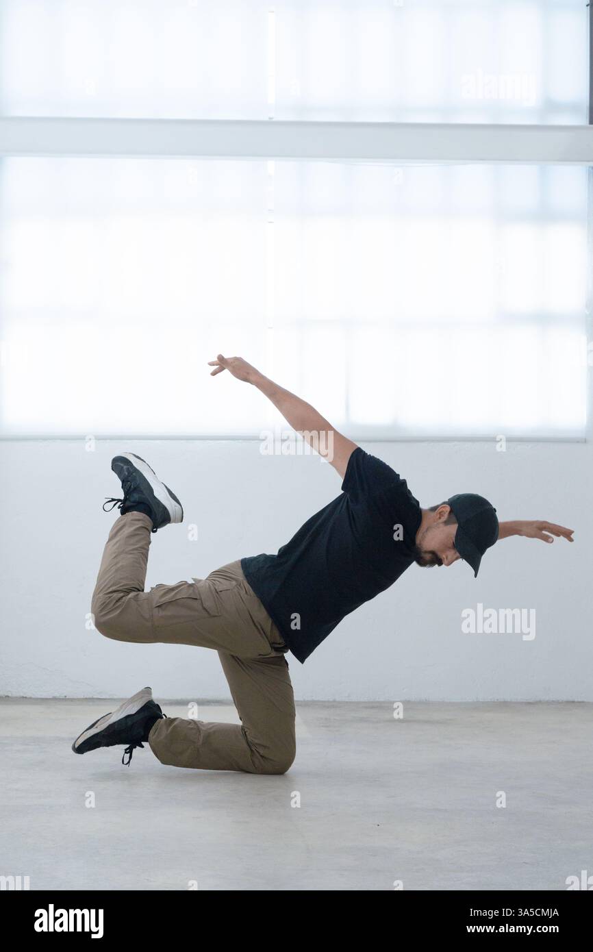 An Exceptional Dynamic Breakdancer Captured in a Powerful Pose, Highlighting Artistry and Elegance Stock Photo