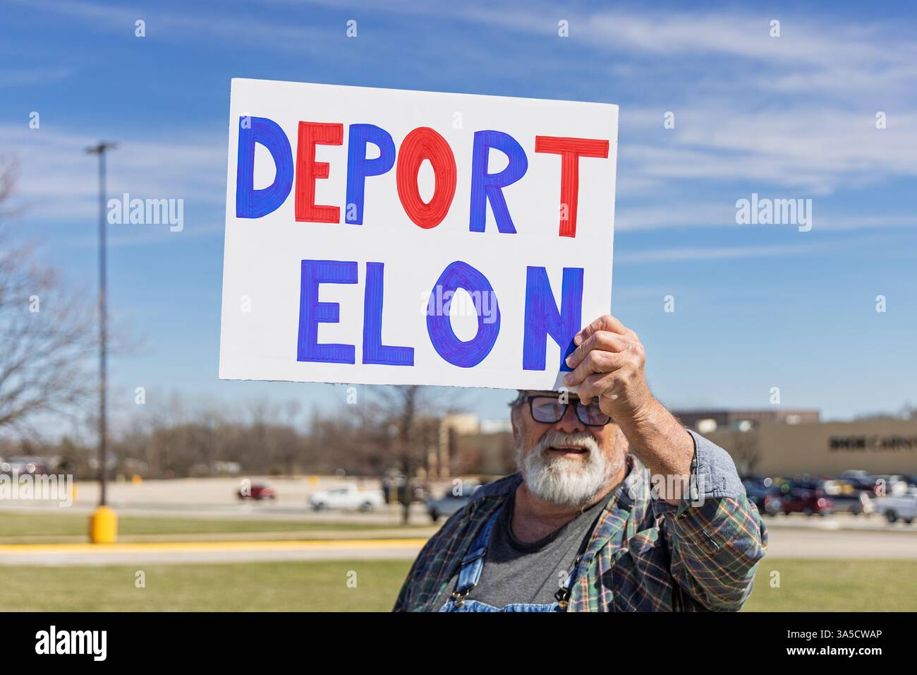 West Burlington, Iowa, USA. 22nd March, 2025. Citizens from the Indivisible  Iowa movement held a protest rally in West Burlington, Iowa, USA on 22nd  March, 2025. The people are dissatisfied with Trump