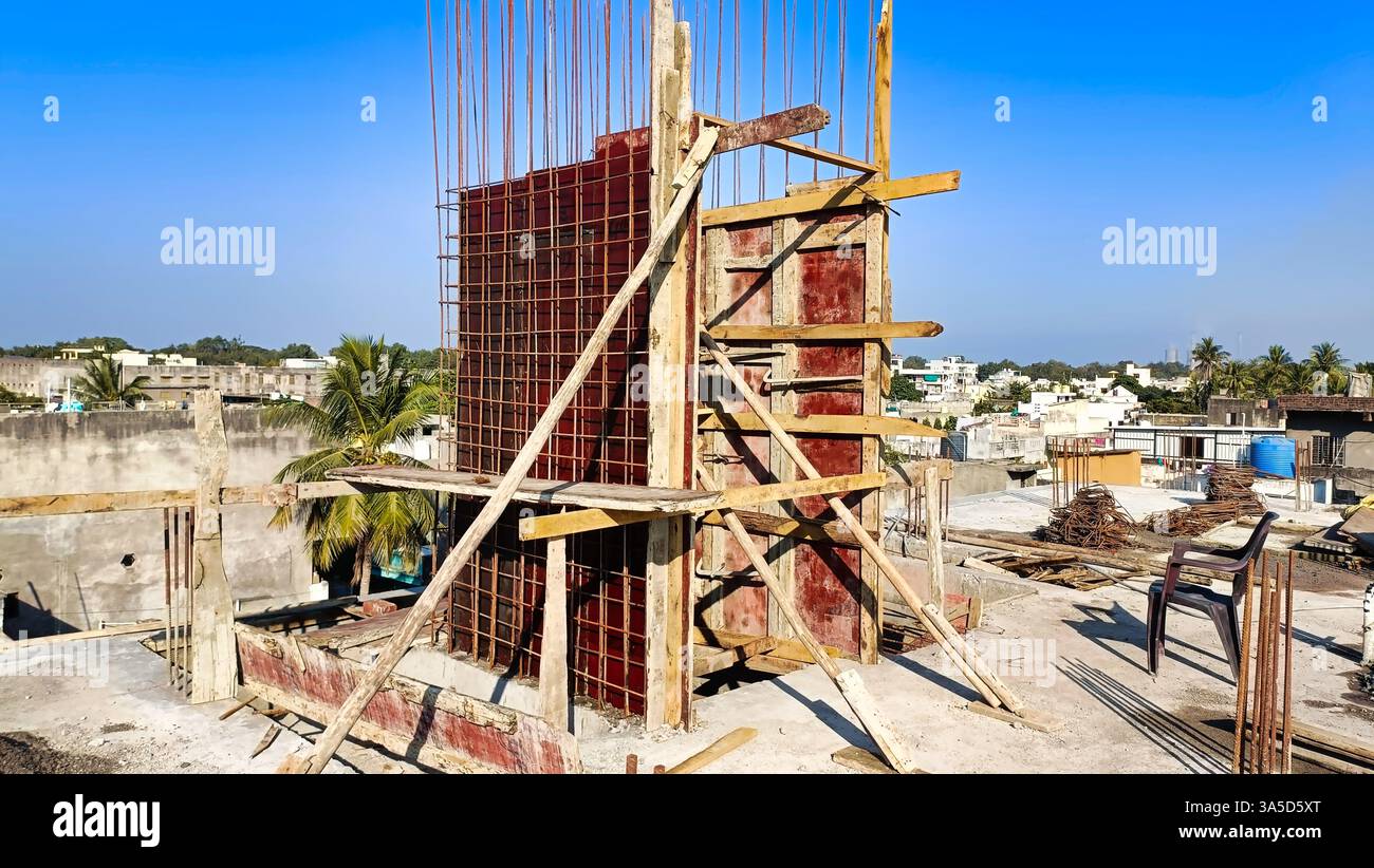 Workers are setting up the steel framework for a new building at the ...