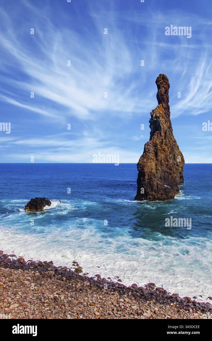 Two huge scenic rocks near the pebble beach. Magic travel on the volcanic island of Madeira. Concept of exotic and ecological tourism Stock Photo