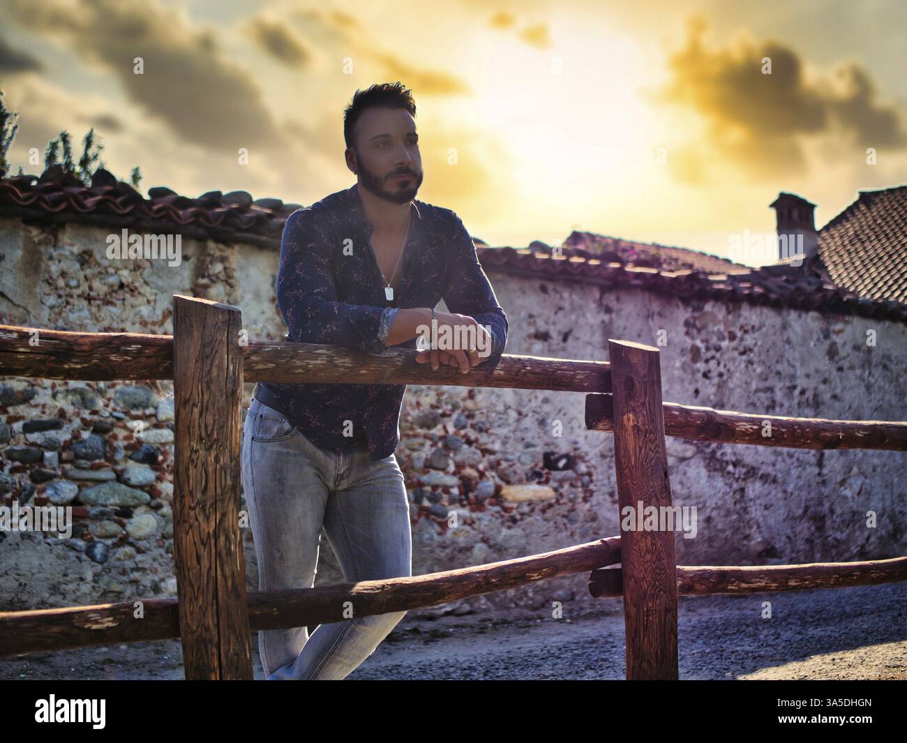 man-leaning-against-wooden-fence-hi-res-stock-photography-and-images