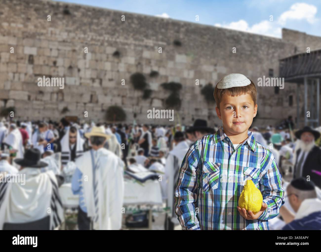 People in white Taliths pray at the Western Wall of the Temple - the ...