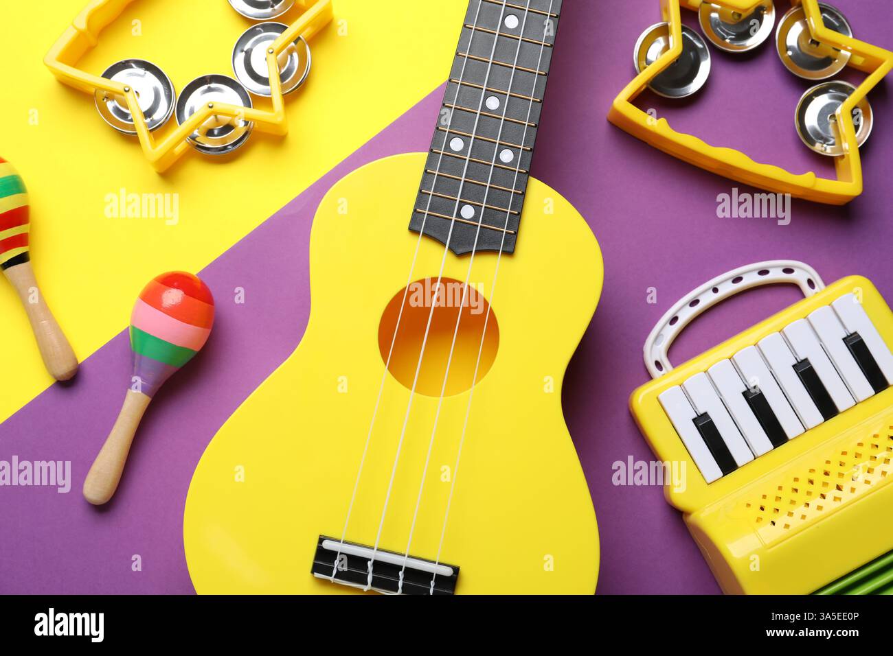 Flat lay composition with different toy musical instruments on color background Stock Photo