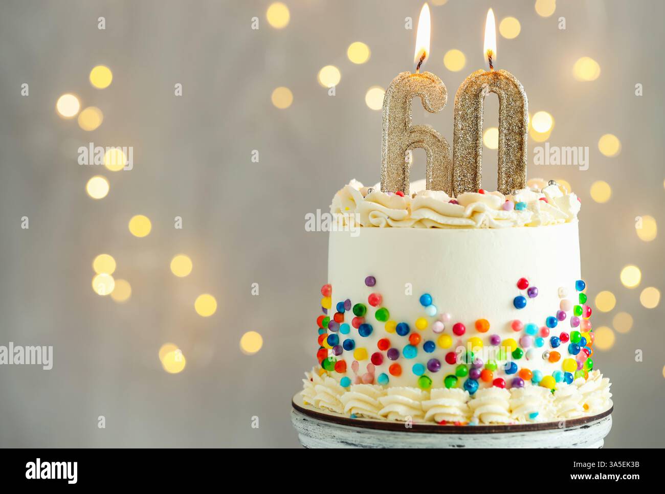 60th birthday. Tasty cake with burning number shaped candles and ...