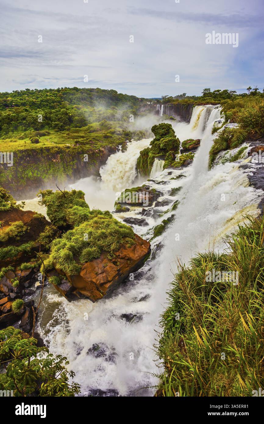 Active Waterfall World of falling water. The waterfalls Iguazu. Picturesque basaltic ...