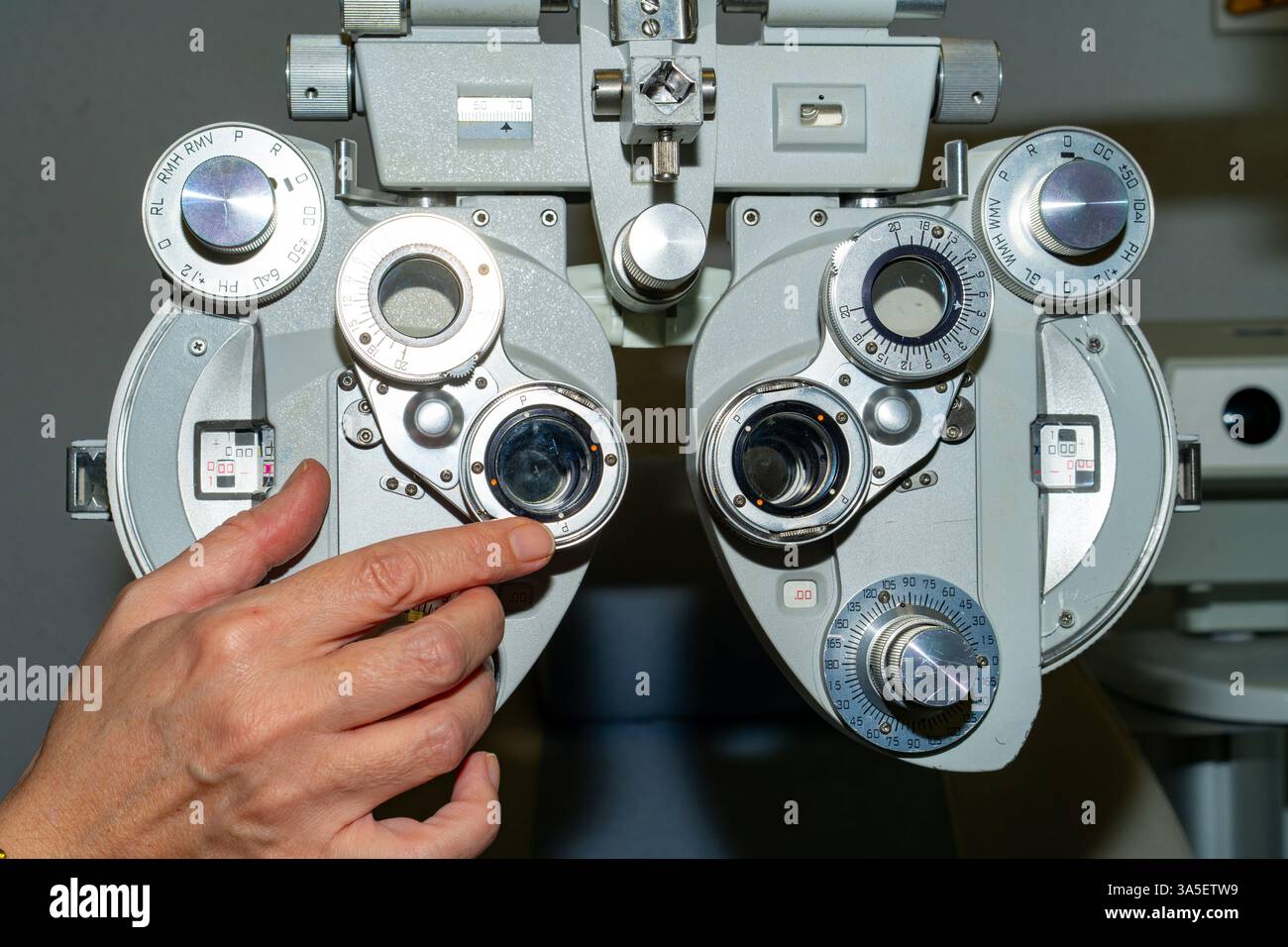 Anonymous person demonstrating with index finger on cylinder axis ...