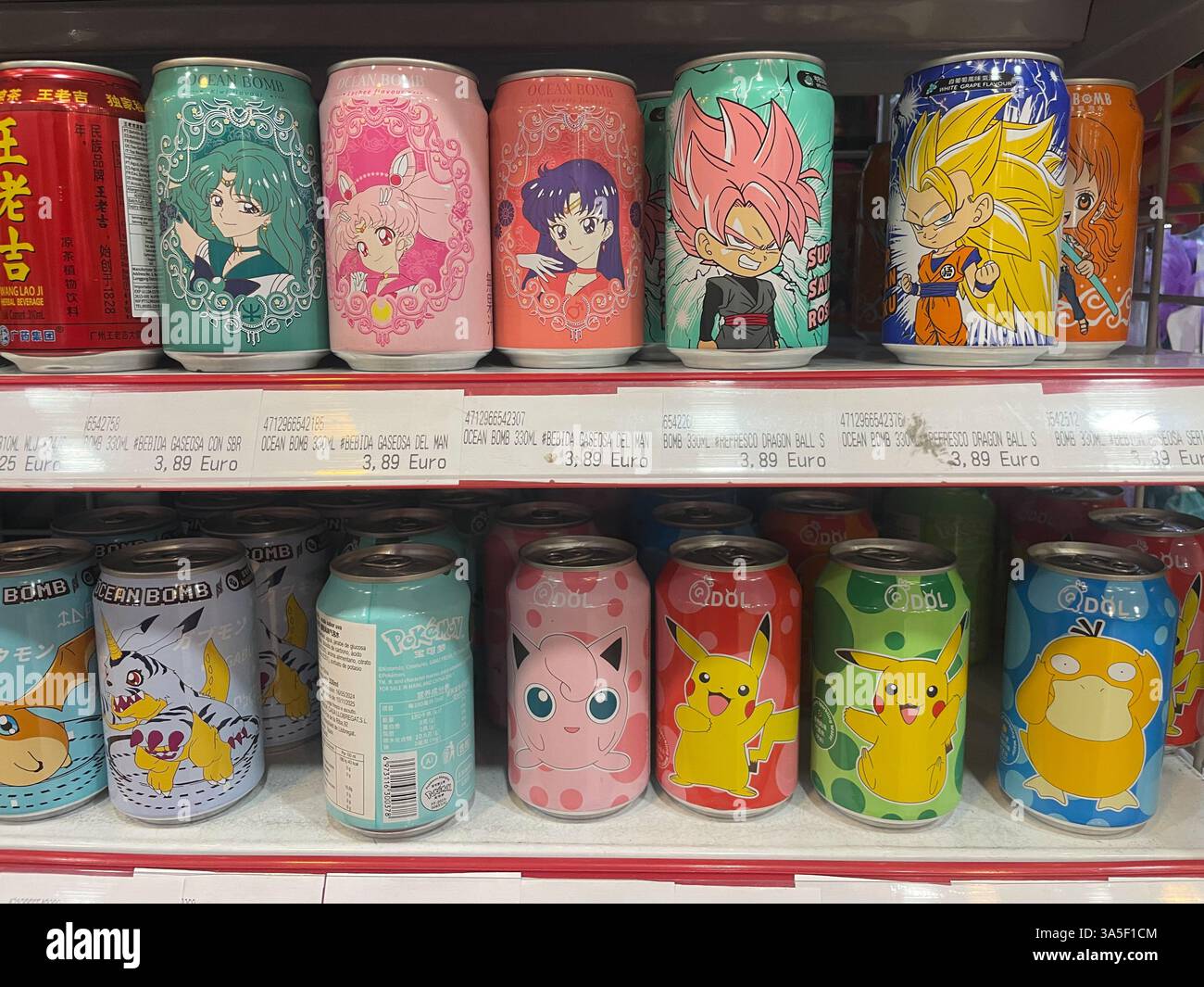 Assorted drinks, Ocean Bomb and QDOL, pokemon cans, arranged on a shelf, on a chinese store in Barcelona, Catalonia, Spain - Smartphone Captured Stock Image