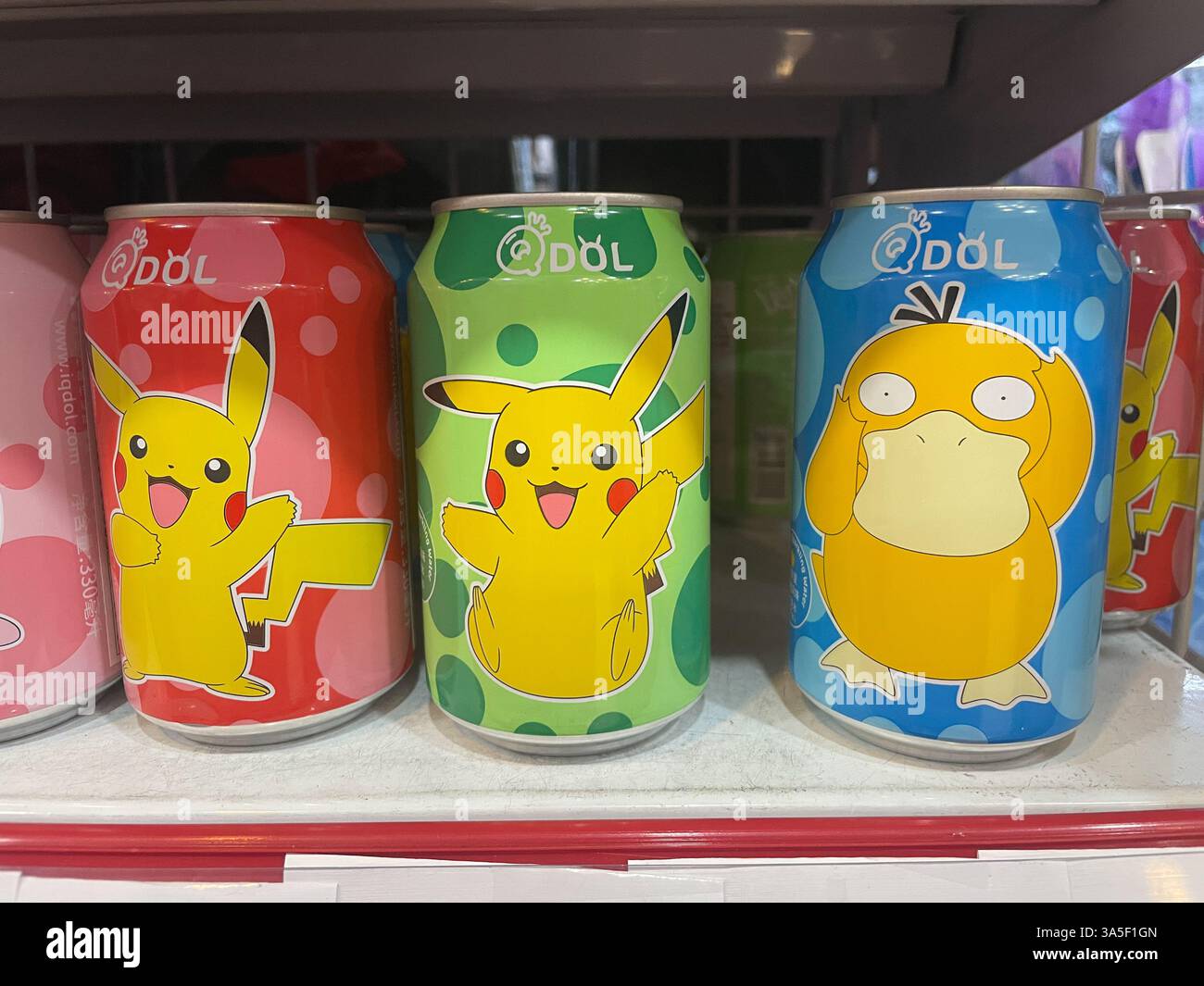 Assorted drink, QDOL, pokemon, Pikachu cans, arranged on a shelf, on a chinese store in Barcelona, Catalonia, Spain - Smartphone Captured Stock Image