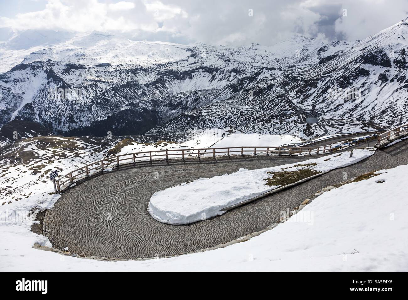 Dizzy turns of mountain serpentine. The cold day. Alpine panoramic mountain road Grossglocknerstrasse. Austrian Alps. The concept of active, ecologica Stock Photo