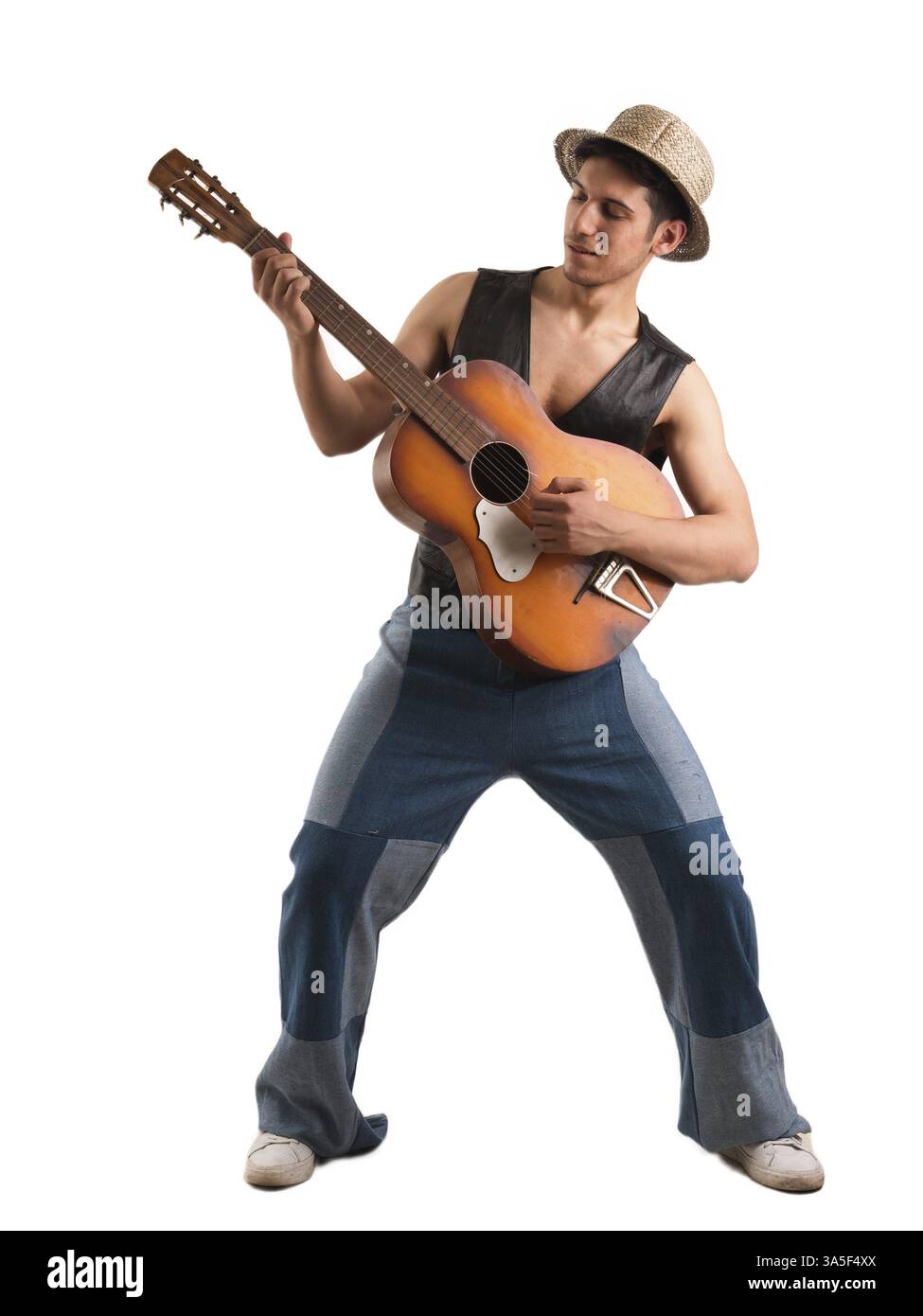 Young attractive man with acoustic guitar, playing in isolated studio shot on white background Stock Photo