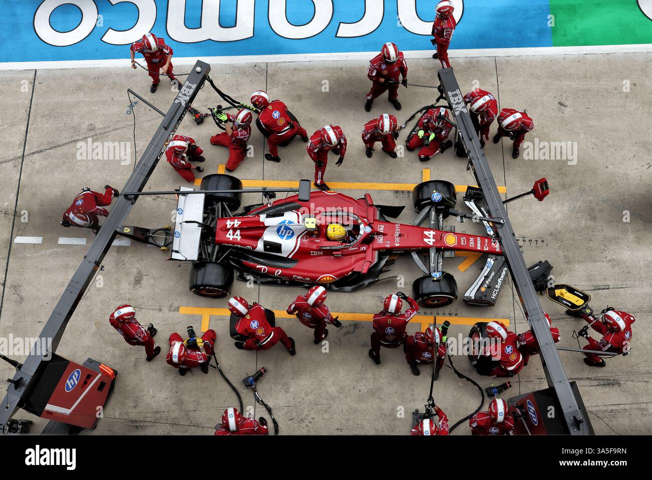 Lewis Hamilton (GBR) Ferrari SF-25 makes a pit stop. 23.03.2025 ...
