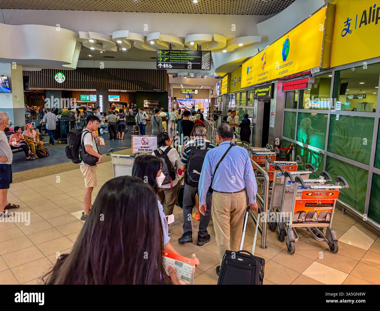 Busy scene at Penang International Airport, Malaysia showing passenger ...