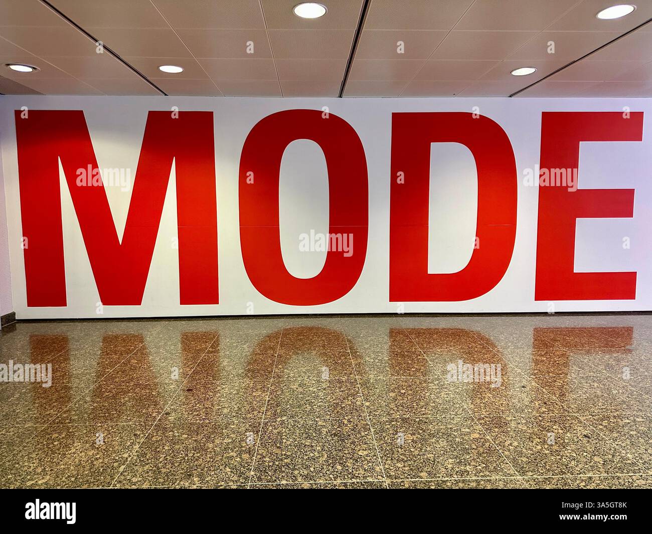 The Germany word Mode (Fashion) in red letters - Smartphone Captured Stock Image