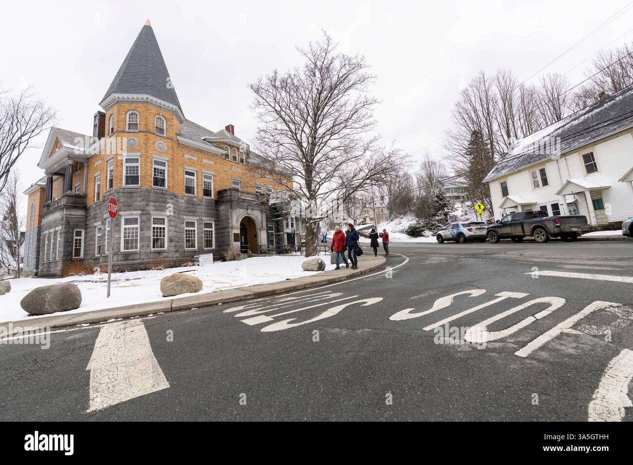 People walk past the Haskell Free Library and Opera House in Derby Line ...