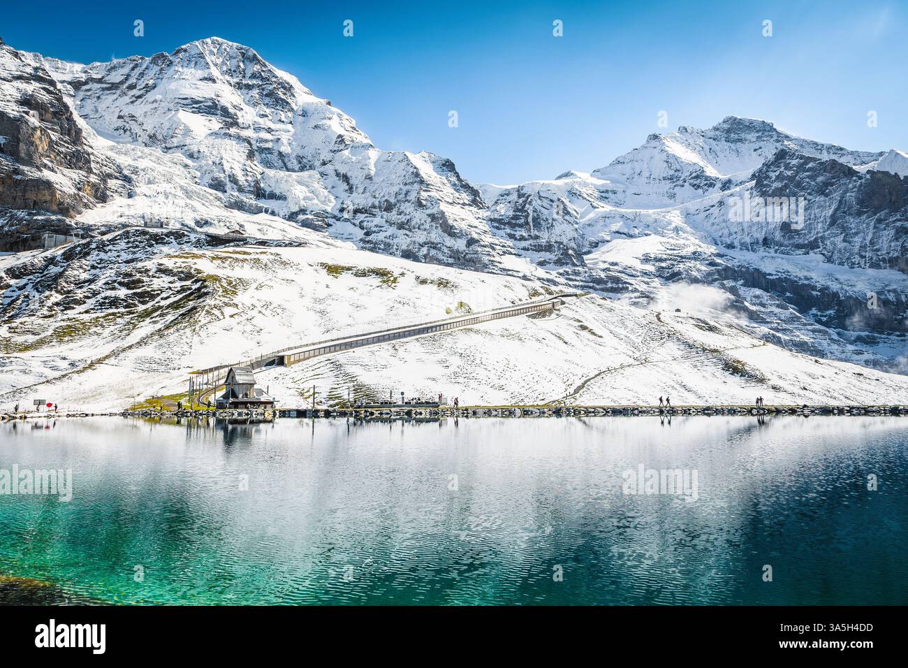 Spectacular turquoise alpine lake and beautiful snowy mountains, lake Fallbodensee, Kleine Scheidegg, Grindelwald, Bernese Oberland, Switzerland, Euro Stock Photo