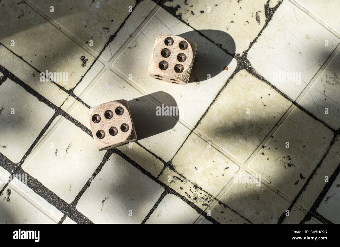 Two wooden dices on table Stock Photo