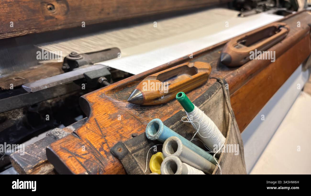 Vintage old weaving loom machine cast metal iron process cloth manufacture. Manufaktura museum in Łódź - Smartphone Captured Stock Image