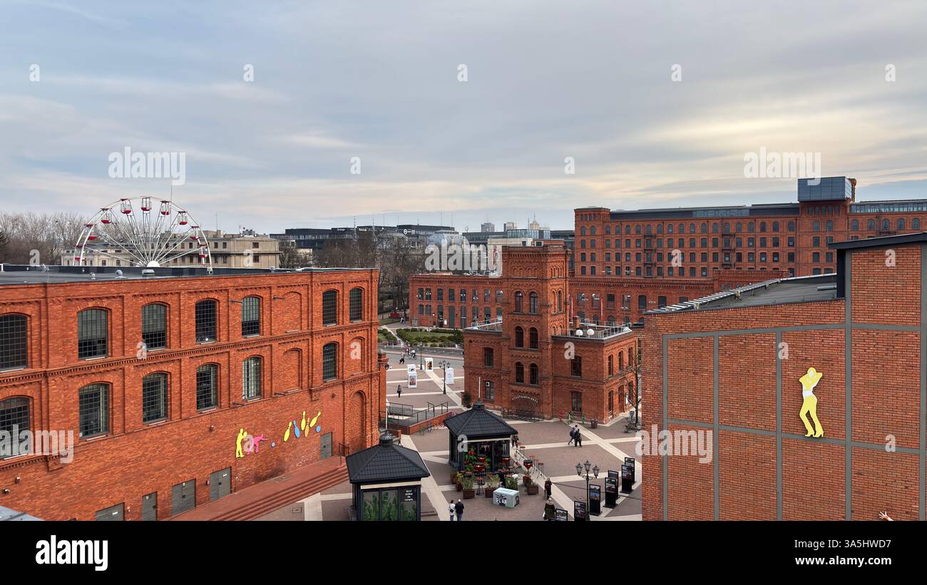 Red brick factory Manufaktura shopping centre Łódź, Poland. Polish factory buildings renovated in Lodz - Smartphone Captured Stock Image