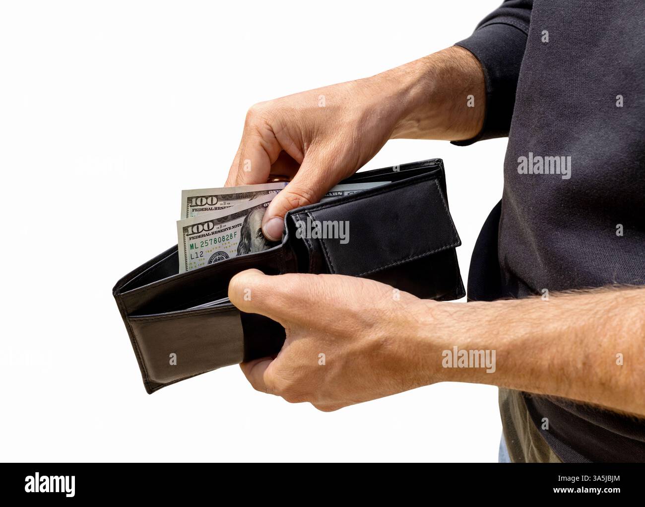 Cutout of black leather wallet with US dollar bills in the hands of a male person Stock Photo