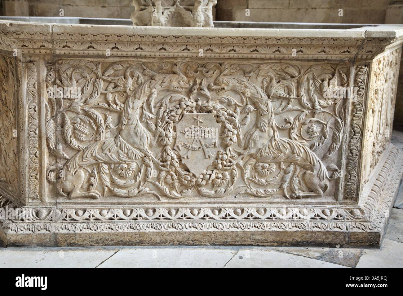 Detailed carvings in stone feature ornate designs and symbols ...
