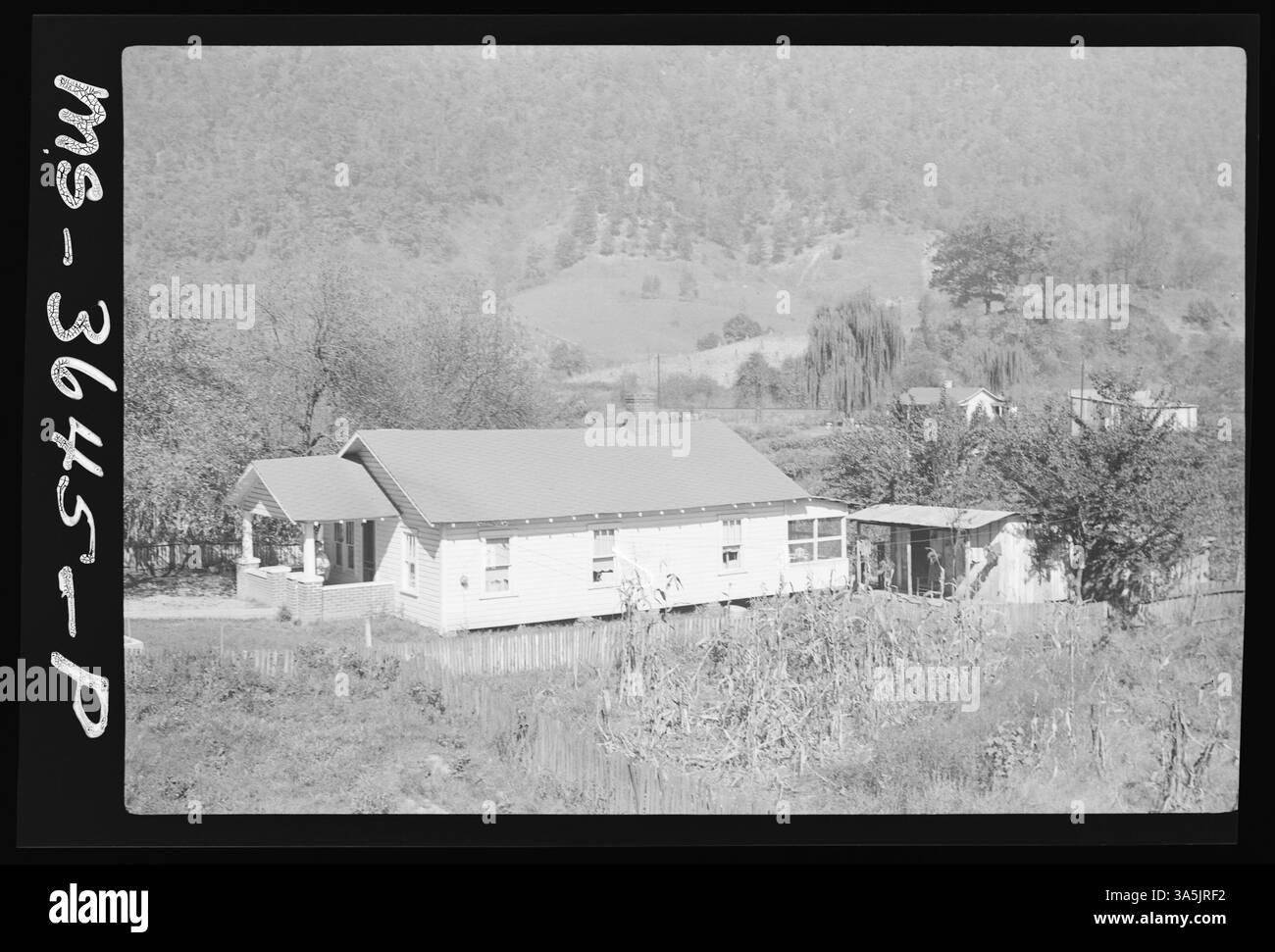 A view of House #1, surveyed at the Margaret Ann Mine in Conaway, Buchanan County, Virginia, showing a well and part of the yard. The image provides insight into the living conditions of mining families. Stock Photo