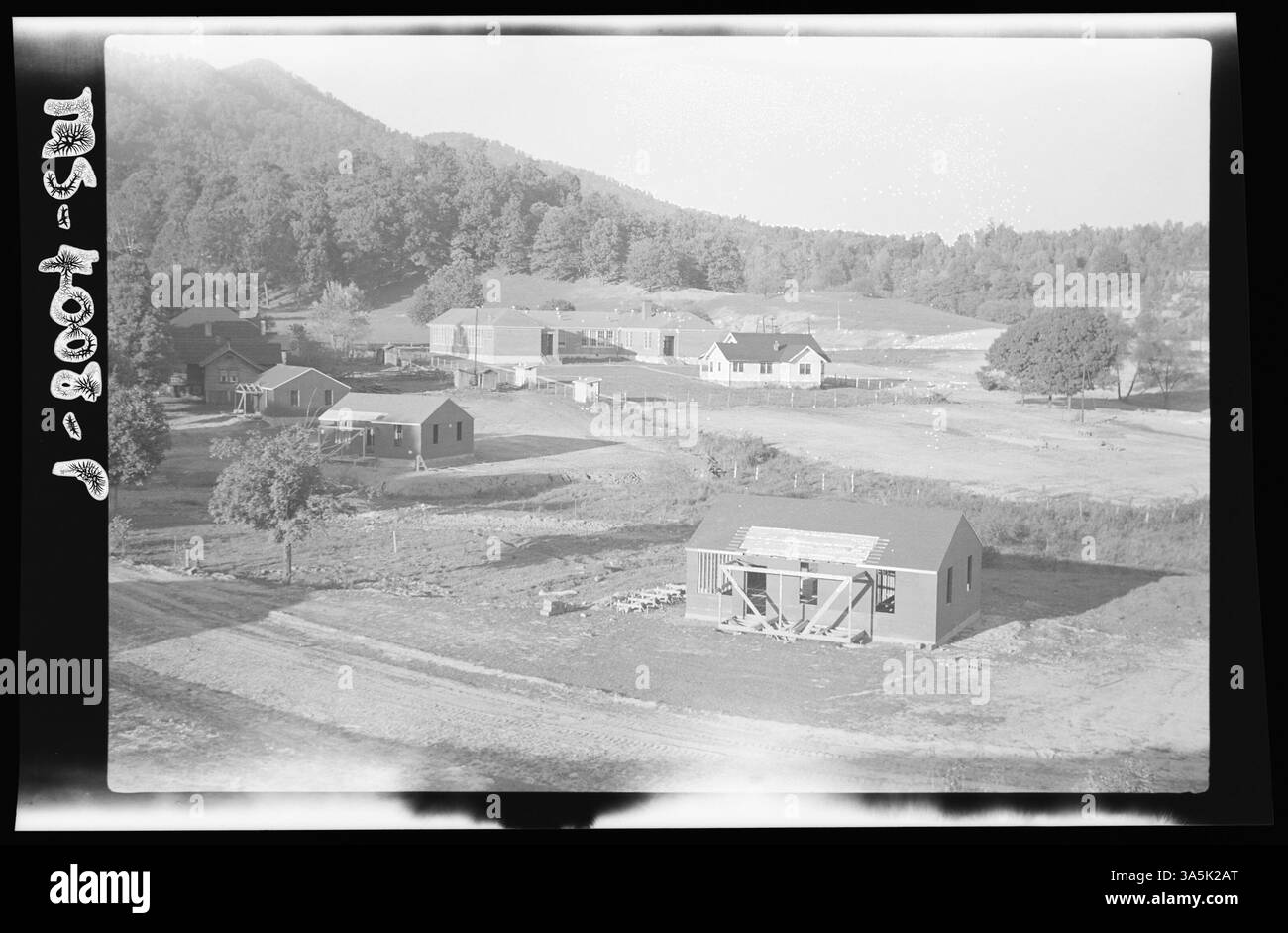 This image depicts the elementary school at Koekee Camp in Lee County, Virginia, part of the Stonega Coal & Coke Company housing project. Plans are in place for four additional classrooms. Stock Photo